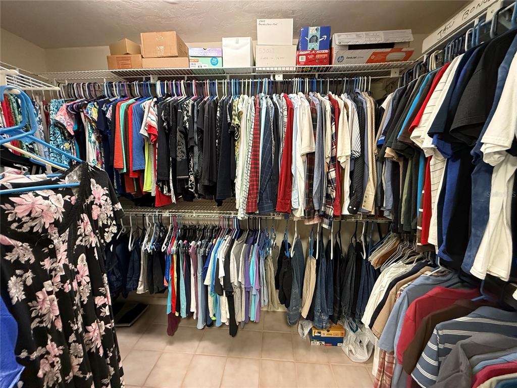 9901 Southwest 67th Terrace Ocala, FL 34476 - Photo 27 of 71 a view of walk in closet with clothes and shoes