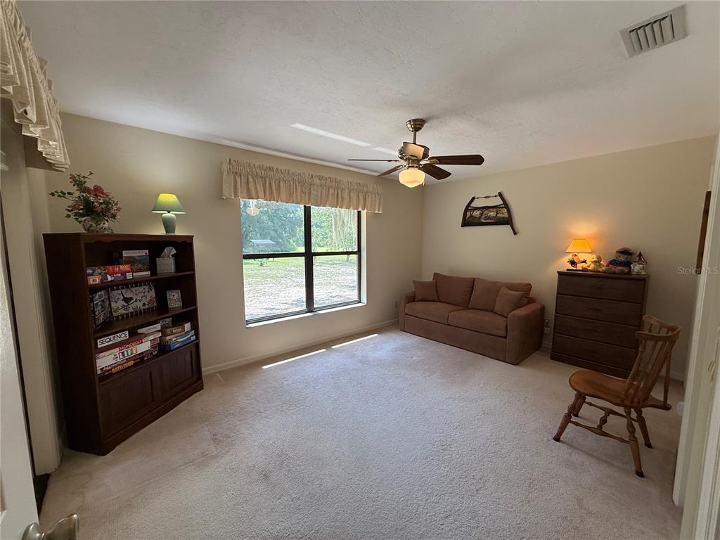 9901 Southwest 67th Terrace Ocala, FL 34476 - Photo 28 of 71 a living room with furniture and a window