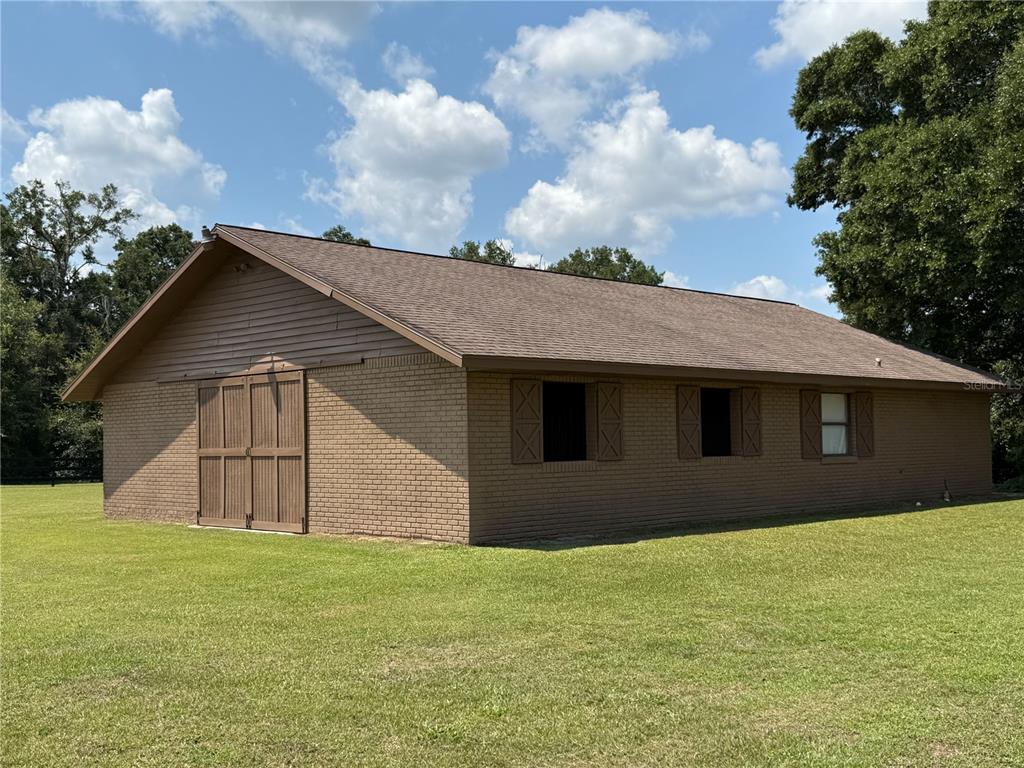 9901 Southwest 67th Terrace Ocala, FL 34476 - Photo 39 of 71 a house with a yard