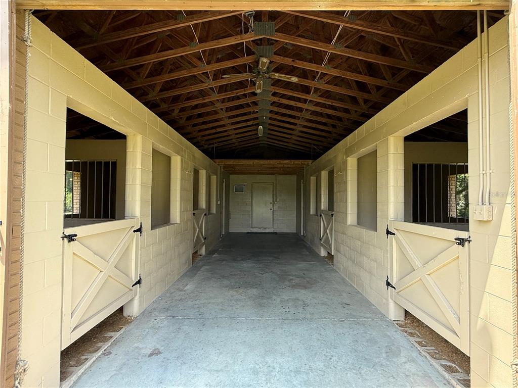 9901 Southwest 67th Terrace Ocala, FL 34476 - Photo 40 of 71 a view of a porch with wooden floor and stairs