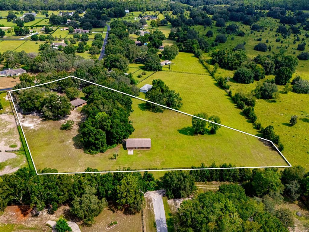 9901 Southwest 67th Terrace Ocala, FL 34476 - Photo 5 of 71 an aerial view of a residential houses with swimming pool