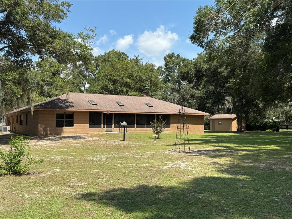 9901 Southwest 67th Terrace Ocala, FL 34476 - Photo 64 of 71 a house view with a swimming pool