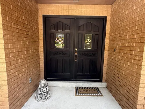 a living room with a fireplace and a flat screen tv
