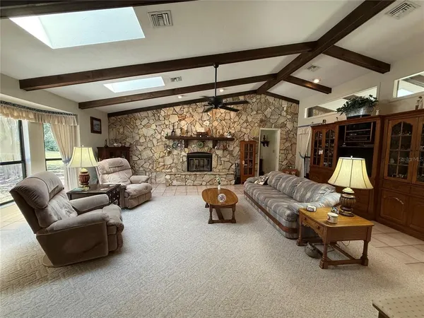 a kitchen with stainless steel appliances a refrigerator and a stove top oven