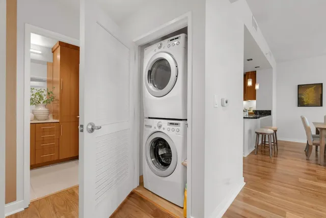a view of a hallway with washer and dryer