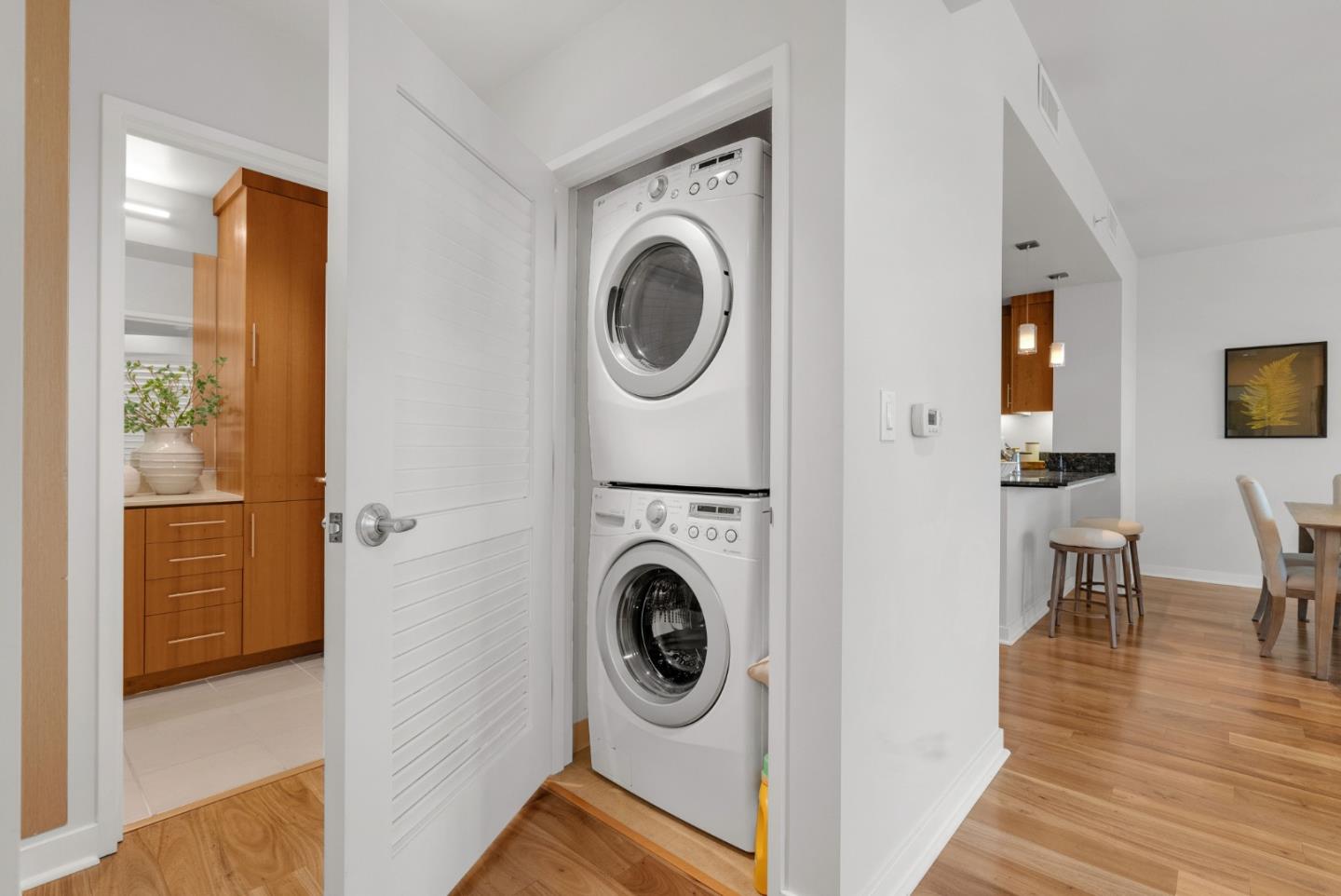 38 North Almaden Boulevard, Unit 1805 San Jose, CA 95110 - Photo 18 of 38 a view of a hallway with washer and dryer