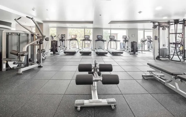 a lobby with furniture and a glass door shower