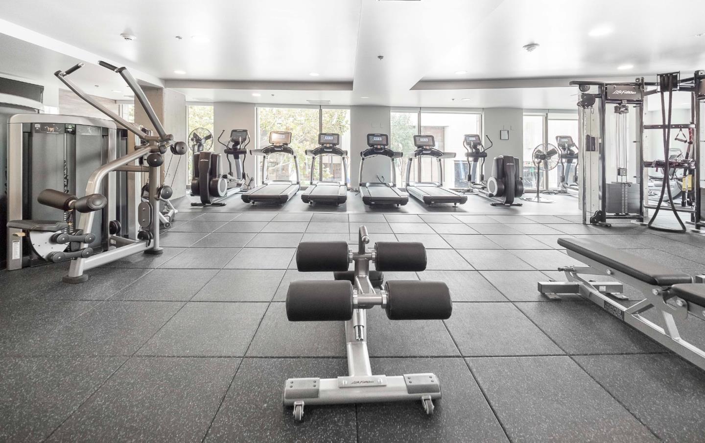 38 North Almaden Boulevard, Unit 1805 San Jose, CA 95110 - Photo 26 of 38 a lobby with furniture and a glass door shower