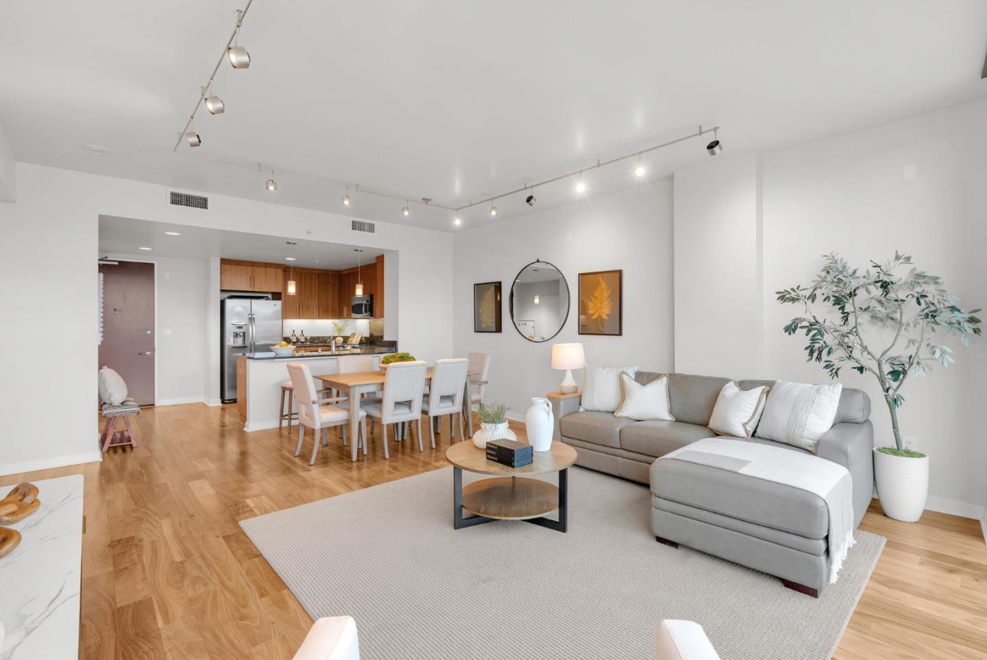 38 North Almaden Boulevard, Unit 1805 San Jose, CA 95110 - Photo 3 of 38 a living room with furniture potted plant and a chandelier