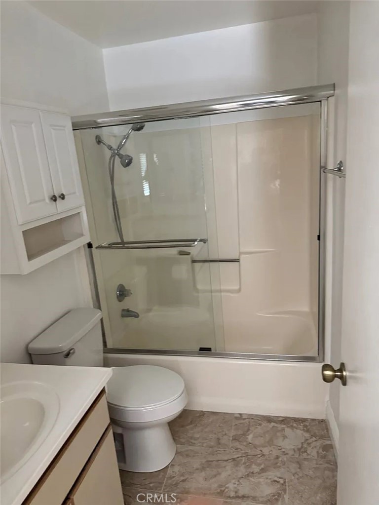3880 West Jacinto View Road, Unit M Banning, CA 92220 - Photo 11 of 12 a bathroom with a shower a toilet and a sink