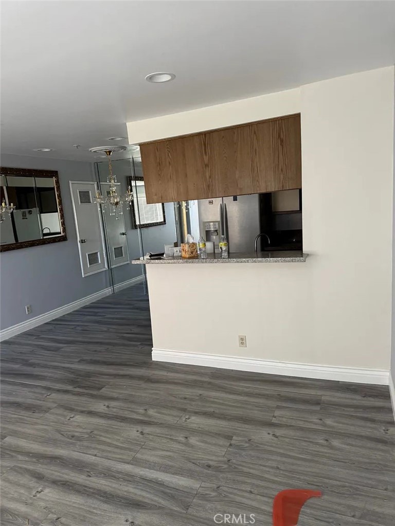 3880 West Jacinto View Road, Unit M Banning, CA 92220 - Photo 4 of 12 a view of a kitchen with cabinets and wooden floor