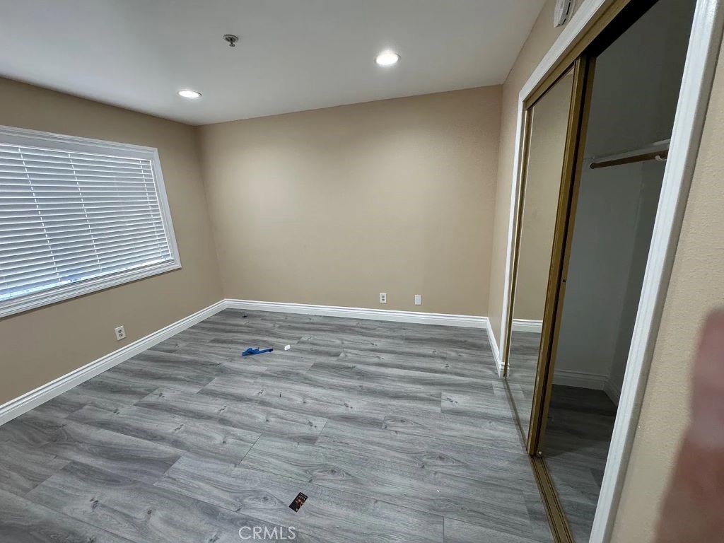 3880 West Jacinto View Road, Unit M Banning, CA 92220 - Photo 5 of 12 a view of room with window and wooden floor