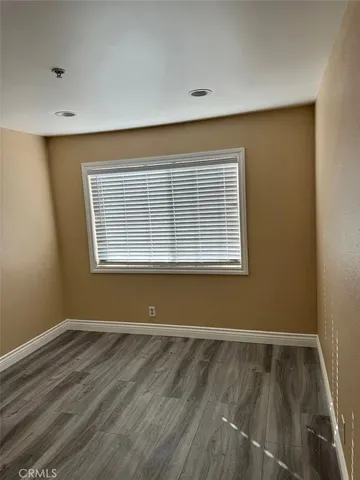 a view of wooden floor in an empty room