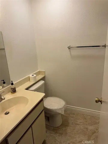 a bathroom with a sink toilet and vanity