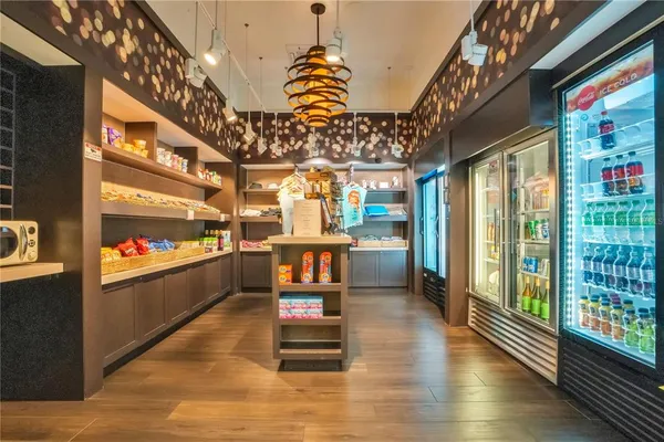 a room with lots of wooden furniture and a chandelier