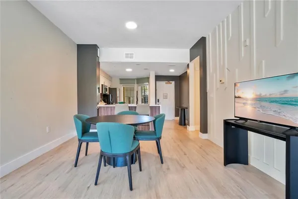 a view of a dining room with furniture and wooden floor