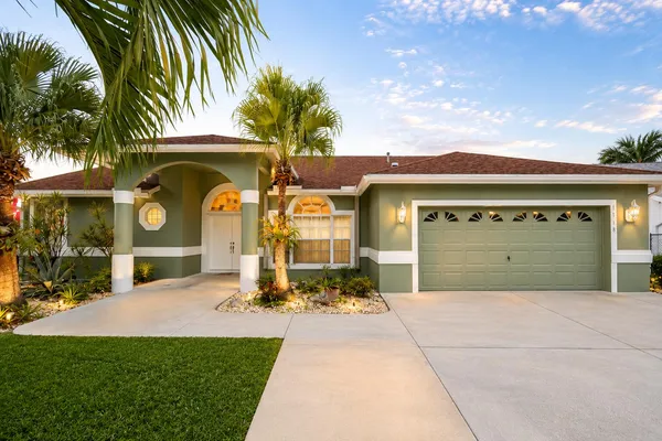 a front view of a house with garden
