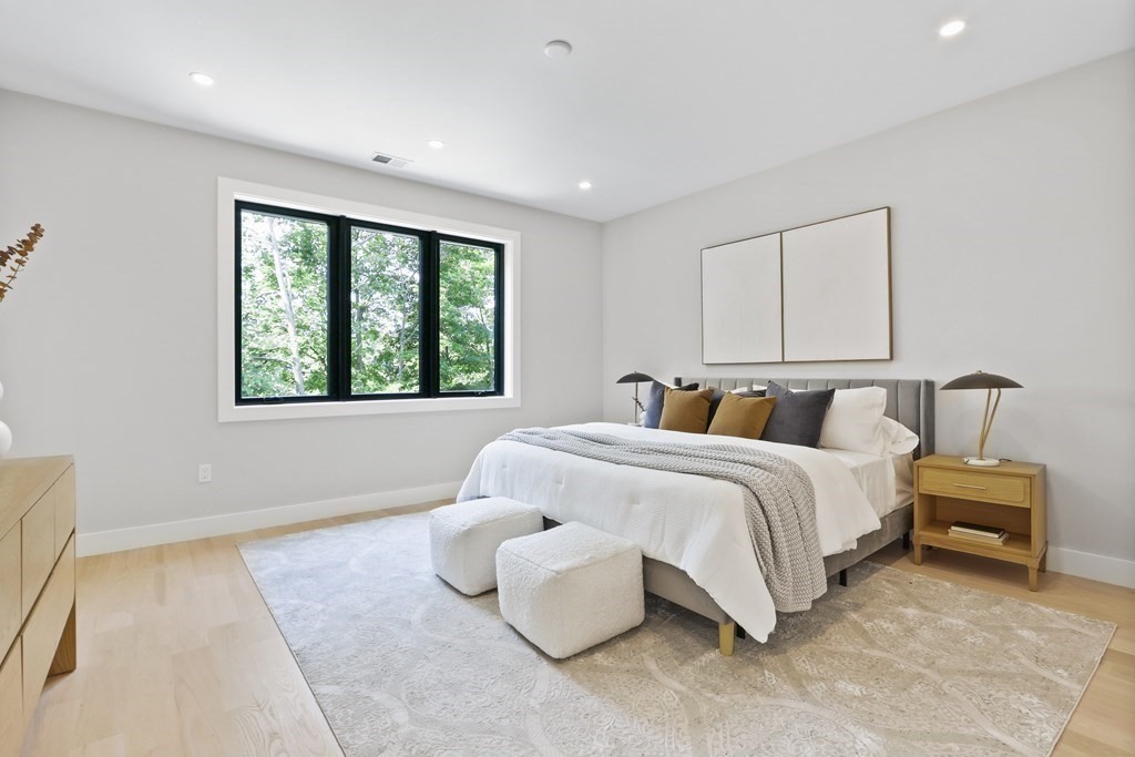 70 Washington Street, Unit 70 Newton, MA 02458 - Photo 11 of 25 a spacious bedroom with a bed and window