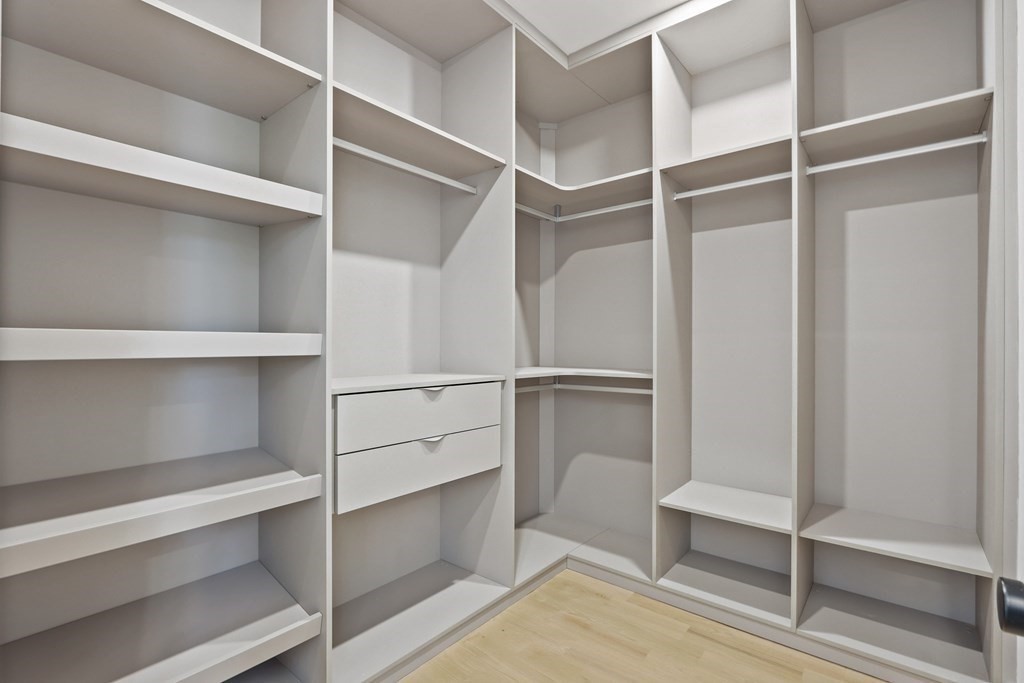 70 Washington Street, Unit 70 Newton, MA 02458 - Photo 14 of 25 a view of walk in closet with empty racks