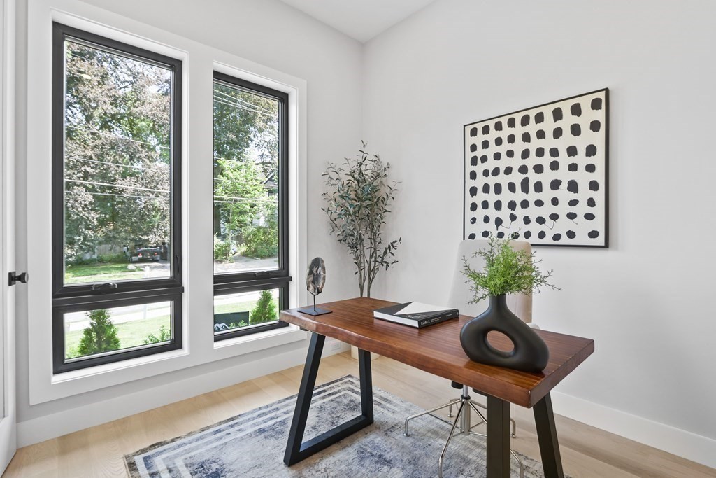 70 Washington Street, Unit 70 Newton, MA 02458 - Photo 15 of 25 a table and chairs in a room
