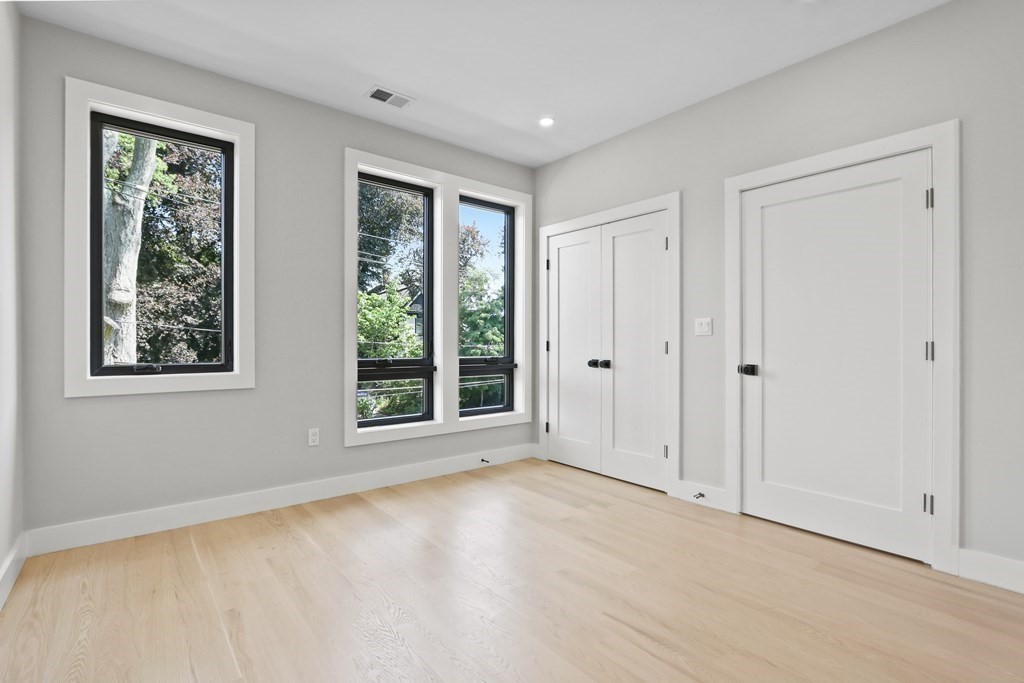 70 Washington Street, Unit 70 Newton, MA 02458 - Photo 18 of 25 a view of an empty room with a window