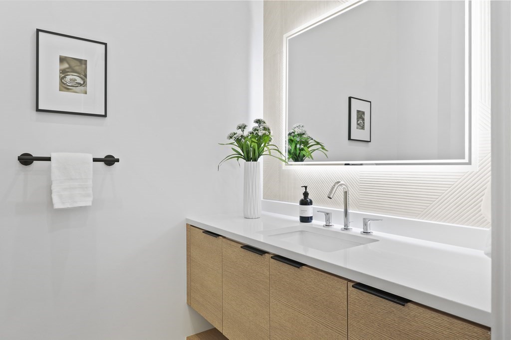 70 Washington Street, Unit 70 Newton, MA 02458 - Photo 19 of 25 a bathroom with a sink and a mirror