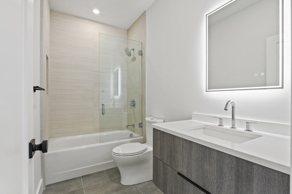 70 Washington Street, Unit 70 Newton, MA 02458 - Photo 20 of 25 a bathroom with a sink a toilet and shower