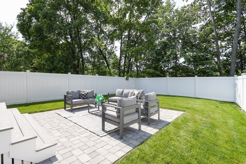 70 Washington Street, Unit 70 Newton, MA 02458 - Photo 22 of 25 a view of a backyard with sitting area
