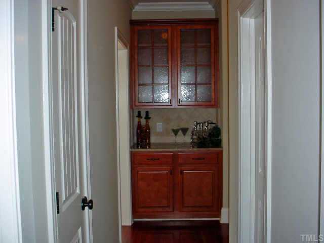 12408 Angel Road Raleigh, NC 27606 - Photo 6 of 12 a kitchen with a window and cabinets