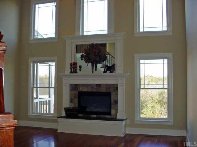 12408 Angel Road Raleigh, NC 27606 - Photo 8 of 12 a living room with furniture and a fireplace