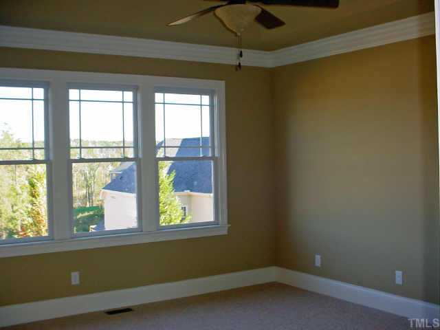 12408 Angel Road Raleigh, NC 27606 - Photo 9 of 12 an empty room with a window
