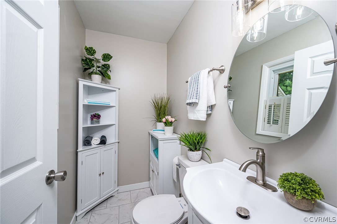 14221 Harrowgate Road Chester, VA 23831 - Photo 12 of 24 New tile flooring; new pedestal sink; New toilet F