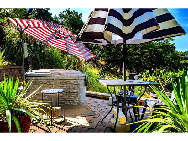 a view of a chairs and table in the patio