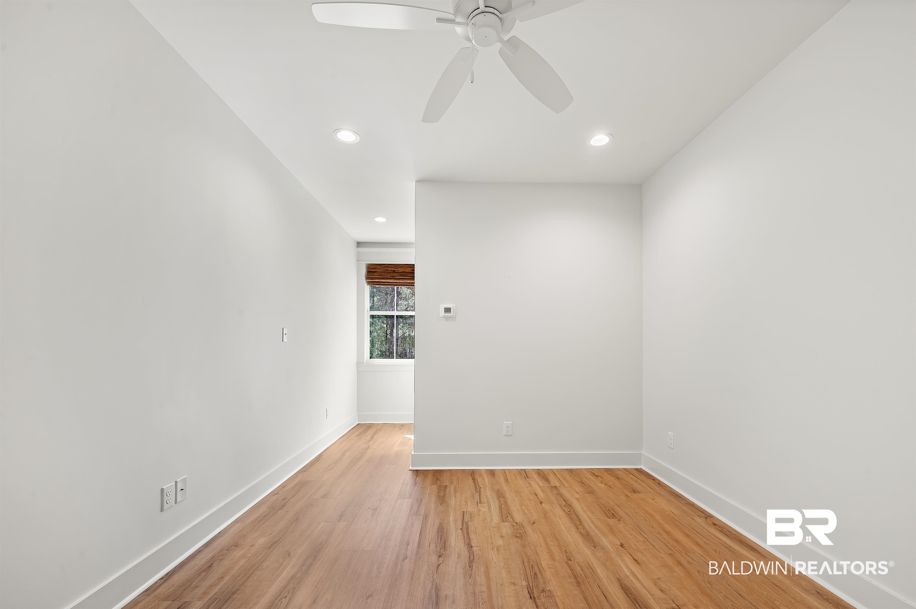 27888 Oakachoy Loop Daphne, AL 36526 - Photo 46 of 65 Spare room with light wood-style flooring, recessed lighting, baseboards, and ceiling fan
