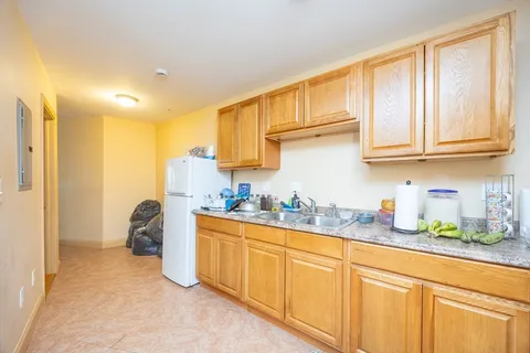 a kitchen with stainless steel appliances granite countertop a sink and cabinets
