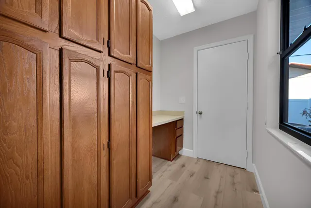 a view of an entryway with wooden floor