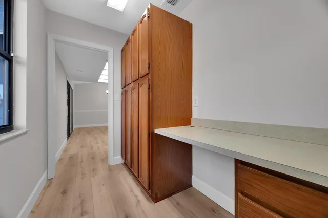 a view of a kitchen from the hallway