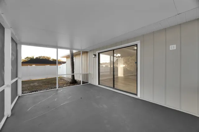 a view of an empty room with a sliding door