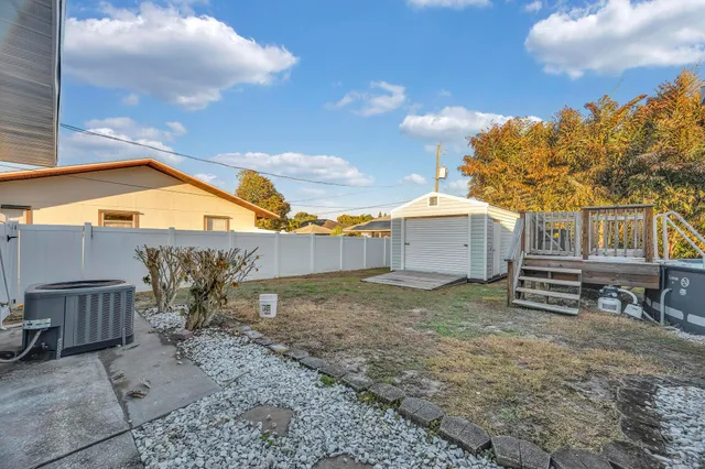 a backyard of a house with wooden fence