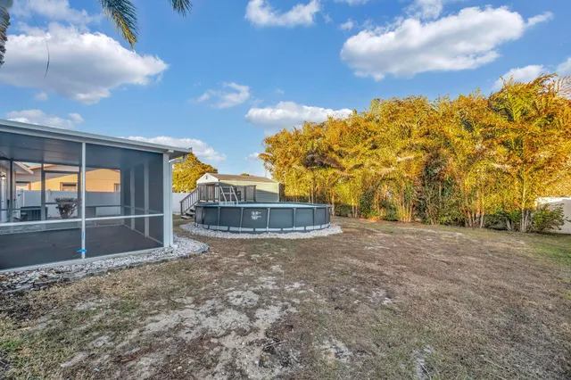 a view of swimming pool with a yard