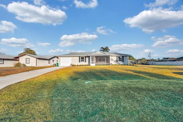 a house view with swimming pool garden and lake view