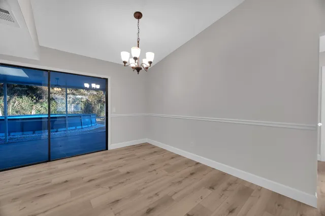 a view of a livingroom with a furniture wooden floor and window