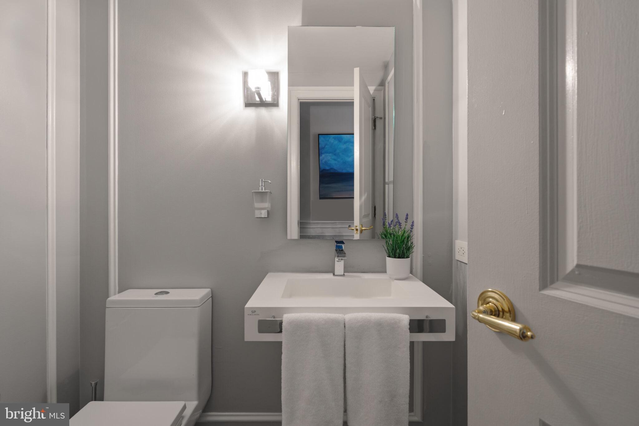 1200 23rd Street Northwest, Unit 910 Washington, DC 20037 - Photo 14 of 41 a bathroom with a sink and a toilet