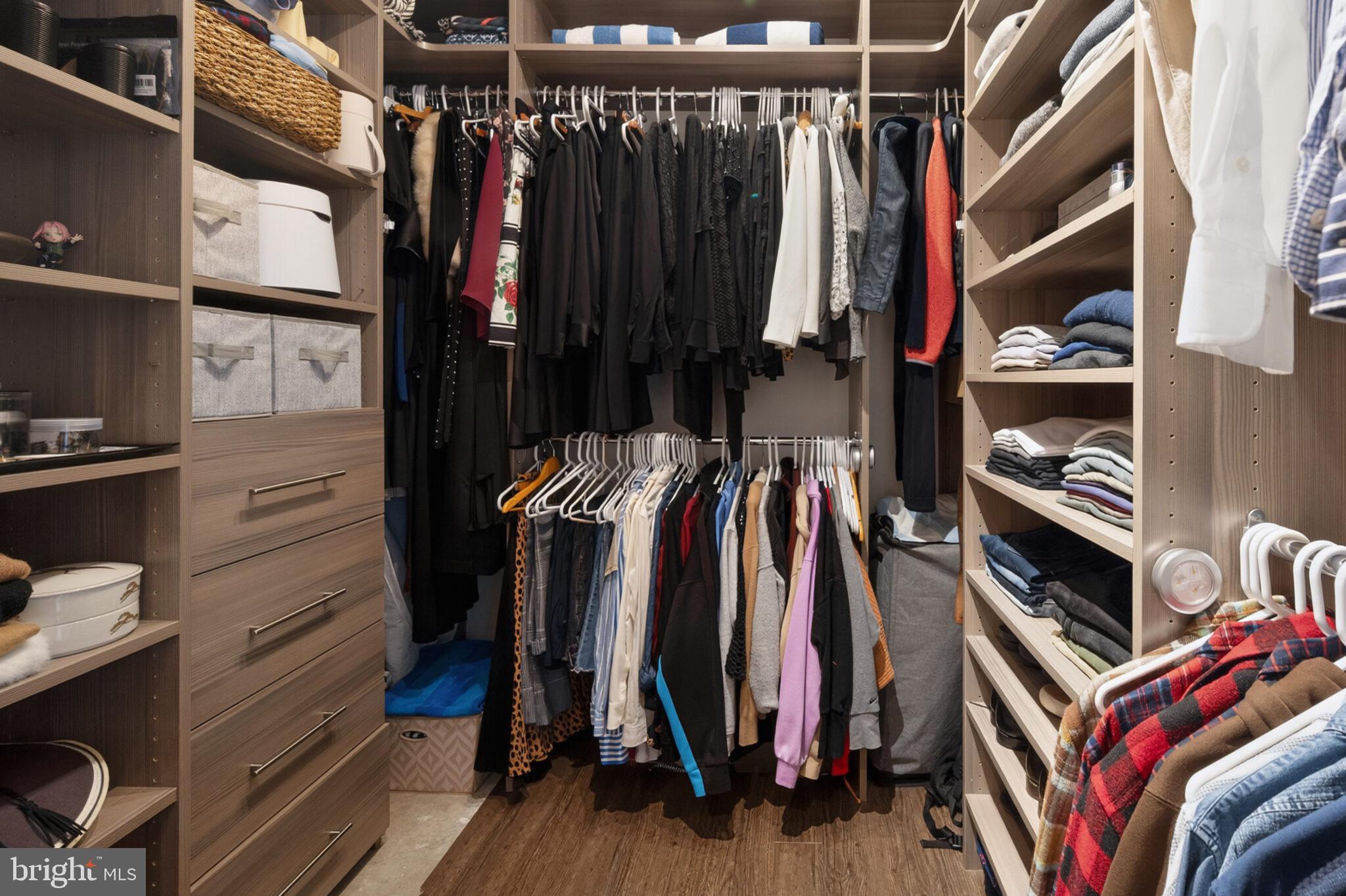 1200 23rd Street Northwest, Unit 910 Washington, DC 20037 - Photo 20 of 41 a view of walk in closet with clothes and shoes