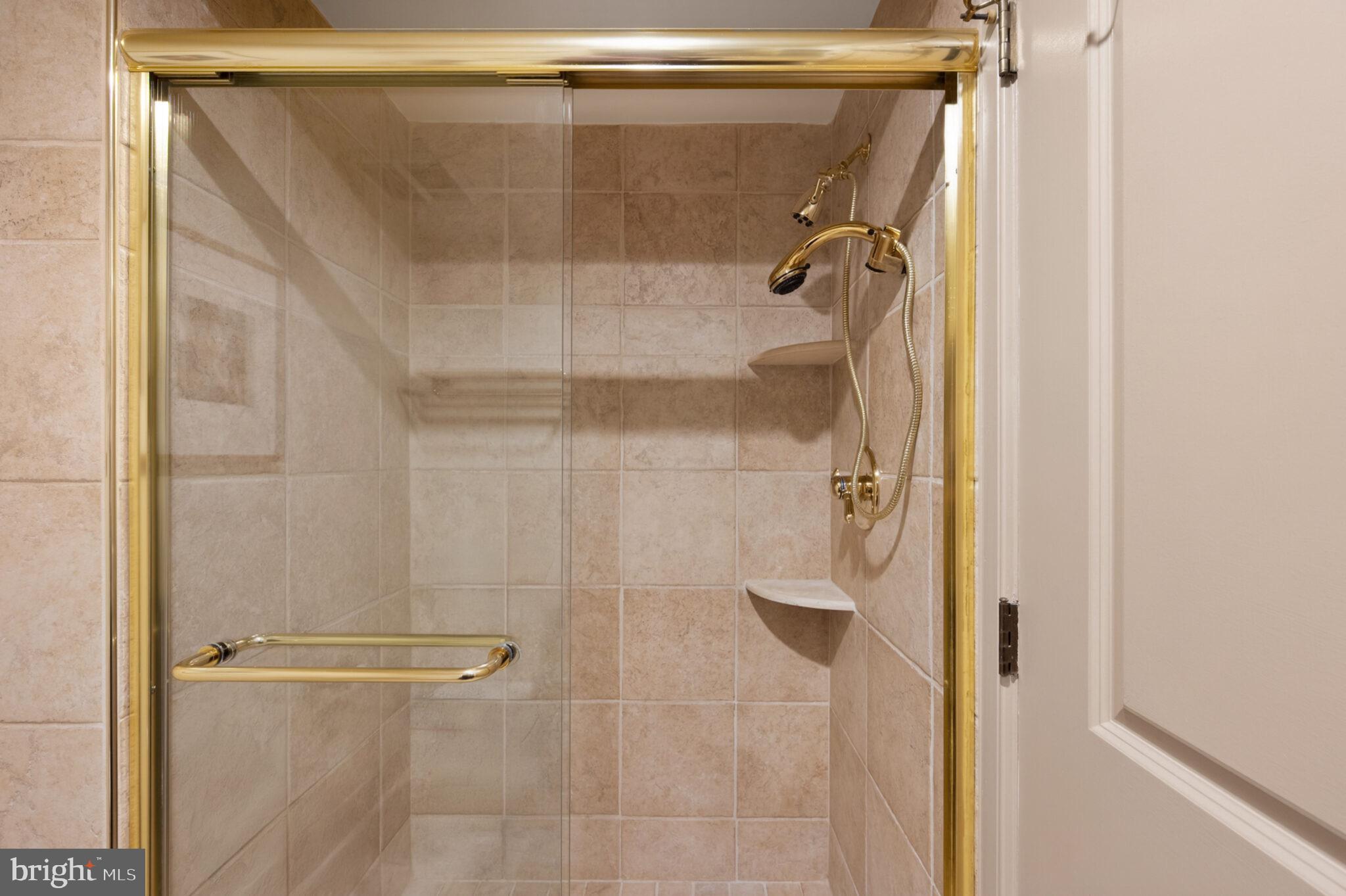 1200 23rd Street Northwest, Unit 910 Washington, DC 20037 - Photo 25 of 41 a bathroom with a glass shower door