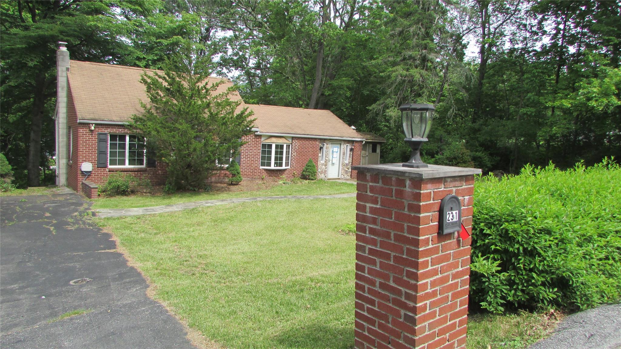 231 Lake View Road Wappingers Falls, NY 12590 - Photo 1 of 1 View of front of property featuring a front yard, brick siding, and a chimney