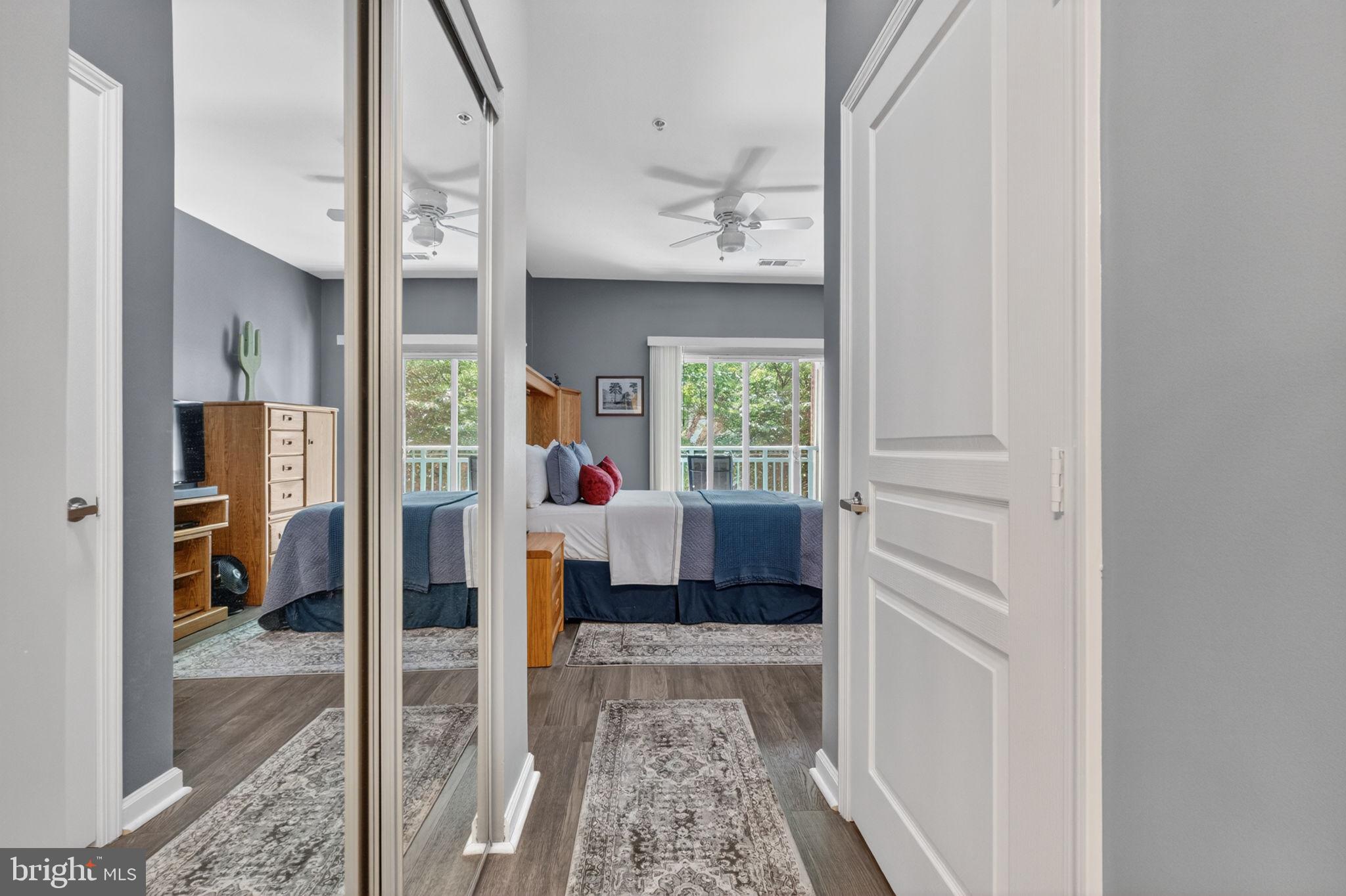 12000 Market Street, Unit 266 Reston, VA 20190 - Photo 20 of 49 Hallway to bathroom with ample closet space