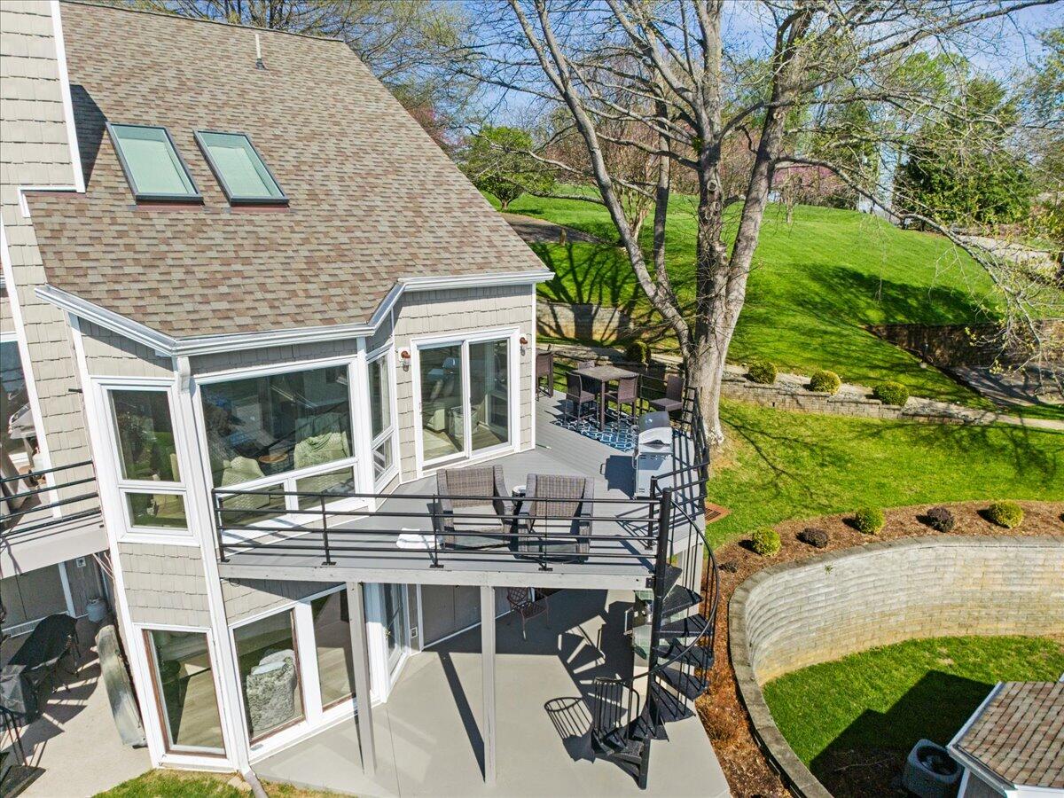 1206 Nature Lane Union Hall, VA 24176 - Photo 101 of 106 a view of a patio with table and chairs potted plants and large tree