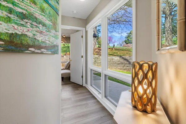 a kitchen with granite countertop a sink stainless steel appliances and white cabinets