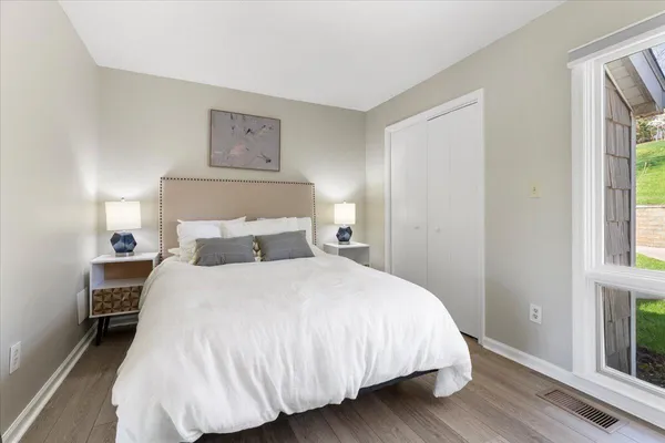 a view of entryway with wooden floor and door